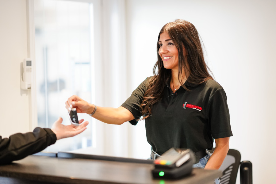 lady handing car keys back to owner 